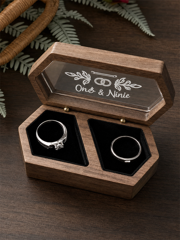 Natural wooden ring box with a screen-printed wordmark on the lid.